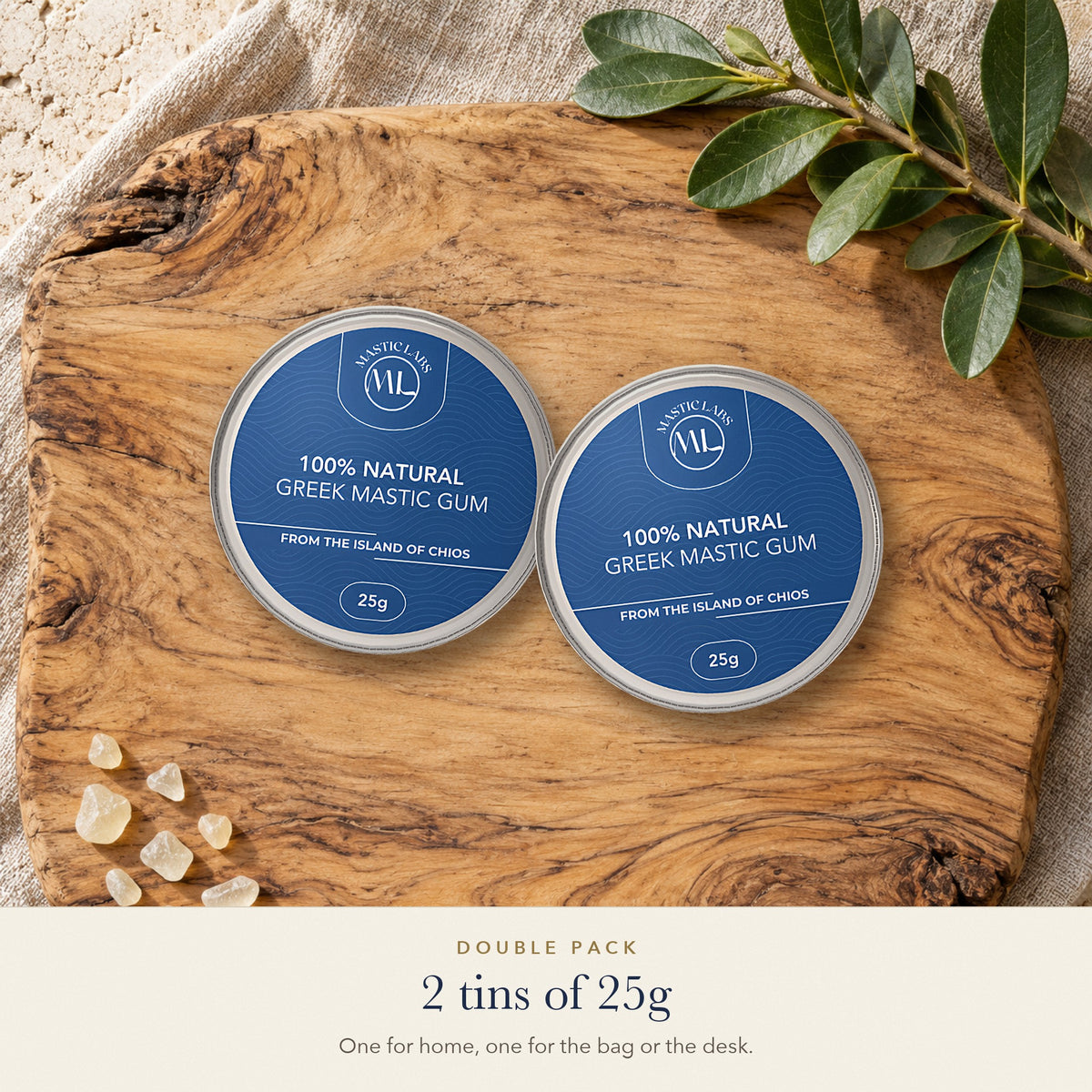 Double pack: two 25g aluminium tins of pure Chios Greek mastic gum on an olive wood board